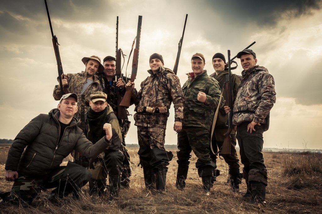 Men wearing hunting clothes