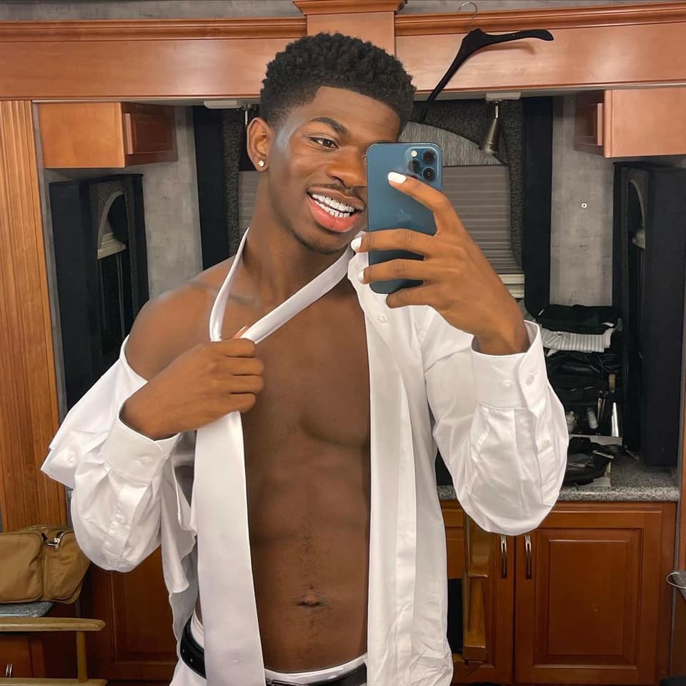 Lil Nas X posing in front of the mirror