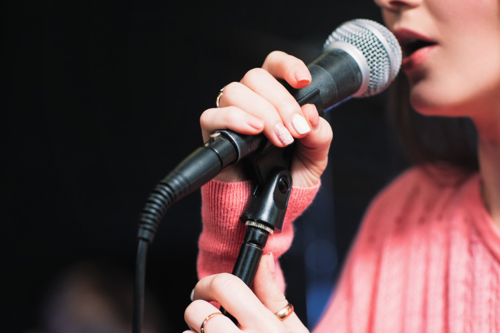 A singer singing on a microphone